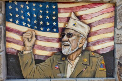 a mural of US Army veteran E4 George Roling on display at Amherst Patriots Park