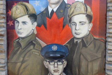 a mural of 4 veterans from the Veroni Family on display at Amherst Patriots Park