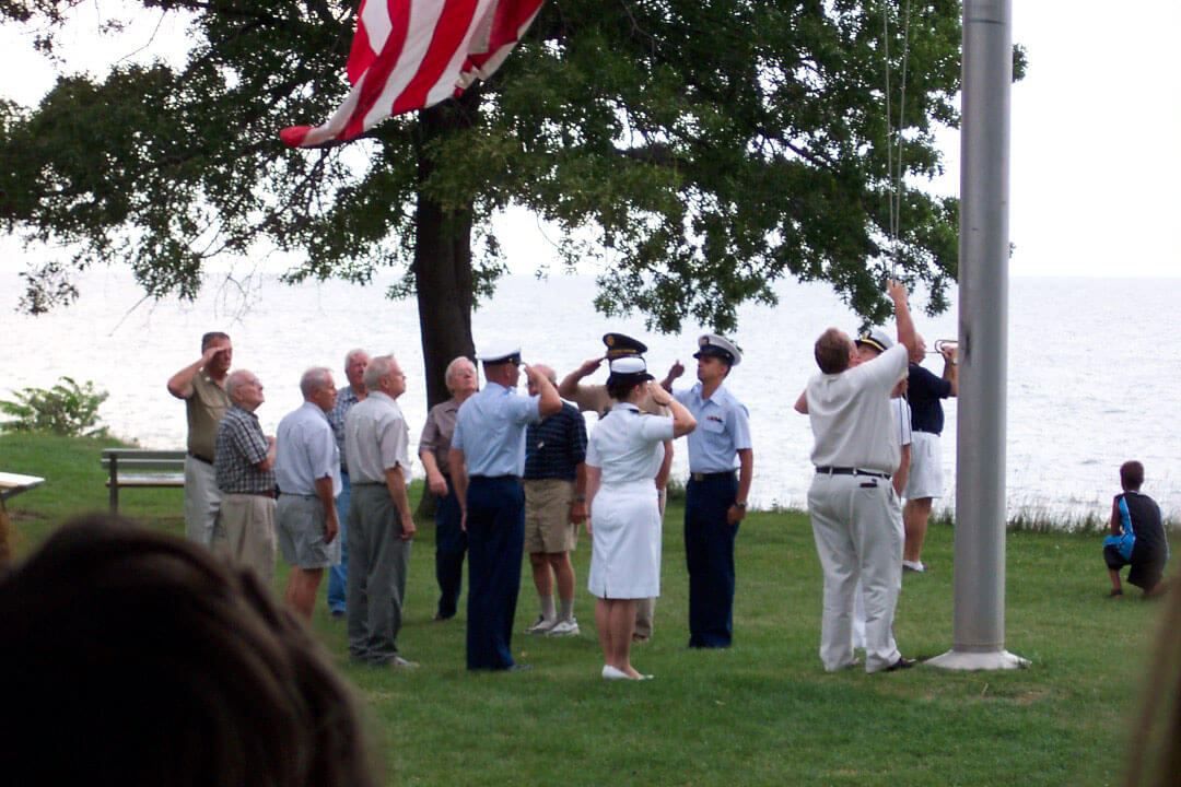 Flag Lowering ceremony during the 103rd O.V.I.'s annual reunion. Retired and active 103rd O.V.I. veterans lowering the flag